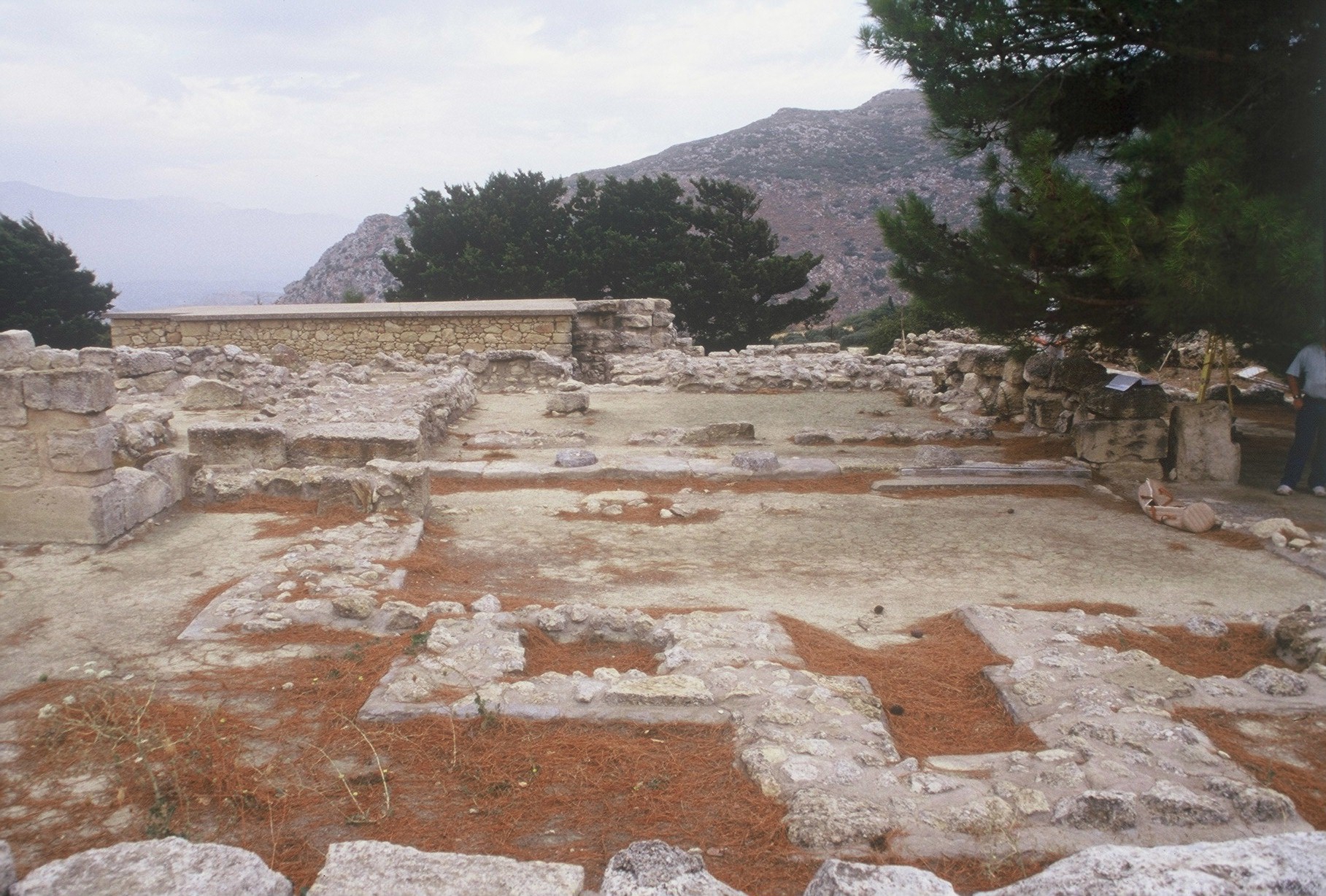 The foundations of the tripartite shrine in the foreground and the pillared hall in the background